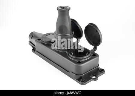 Electrical triple rubber power socket strip with caps and black plug Stock Photo