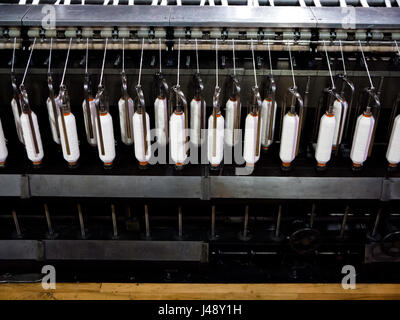 cotton weaving industrial machinery from the era of the industrial revolution. Stock Photo