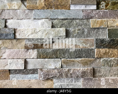 A stone background of a wall and colorful wall stone textures Stock Photo