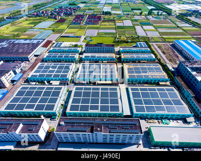 Cixi. 10th May, 2017. Aerial photo taken on May 10, 2017 shows solar panels on roofs in Cixi City, east China's Zhejiang Province. Credit: Xu Yu/Xinhua/Alamy Live News Stock Photo