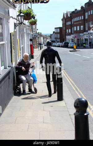 Maldon, Essex, UK. 10th May, 2017. The Gimp Man of Essex appears in the Essex town of Maldon. The mysterious character dressed from head to toe in black latex was seen walking up and down Maldon High Street. The Gimp Man donates a £1 to the mental health charity Mind for each selfie that is taken with him and their was no shortage of people who had their picture taken. Credit: David Johnson/Alamy Live News Stock Photo