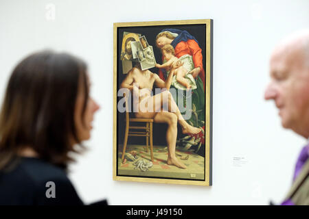 A visitor of a press call stand in front of the painting 'Theophanie' by Michael Triegel at the Museum for Visual Arts ('Museum der Bildenden Kuenste') in Leipzig, germany, 10 May 2017. A cabinet exhibition presents paintings, drawings and graphics dealing with Christian iconography and the topics death and resurrection can be seen from 11 May to 6 August 2017. Photo: Sebastian Willnow/dpa-Zentralbild/ZB Stock Photo