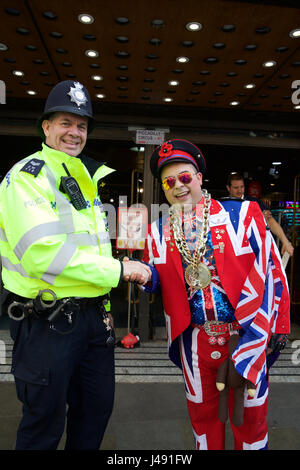London, UK. 10th May, 2017. A police officer with a man dressed in a union jack suit in Piccadilly circus, Central London Credit: Keith Larby/Alamy Live News Stock Photo