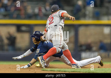 Boston Red Sox shortstop Orlando Cabrera awaits the throw from right  fielder Dave Roberts to get Detroit Tigers' Carlos Guillen trying to  stretch a single into a double during the fourth inning