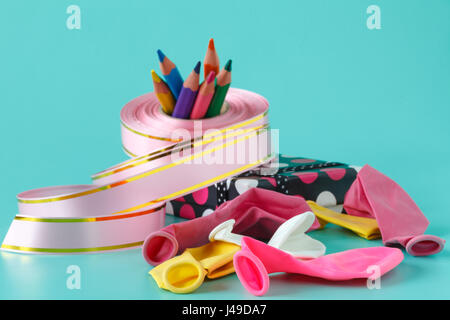 Materials and accessories for wrapping gifts on aquamarine Stock Photo
