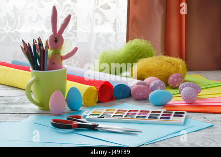 Sheets of colored paper, scissors, glue, pencil, Easter basket and eggs -  set for children art Stock Photo by ©OnlyZoia 116684520