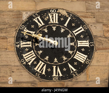 The painted clock face on St Michael's church, Spurriergate, York, England, UK Stock Photo
