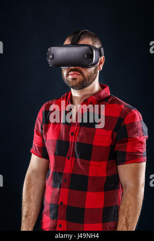 Young man using VR glasses headset Stock Photo