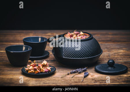 Image of traditional eastern teapot and teacups on wooden desk Stock Photo