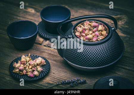 Asian clay teapot with clay bowls Stock Photo