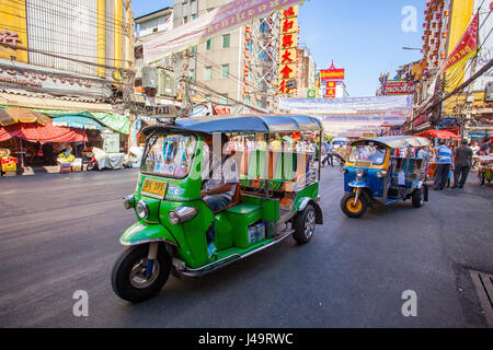 THAILAND BANGKOK - FEB 24  : TukTuk car on traffic  in Yaowarat Road main street in Chinatown,one of Bangkok landmark in bangkok on february 24,2015 i Stock Photo