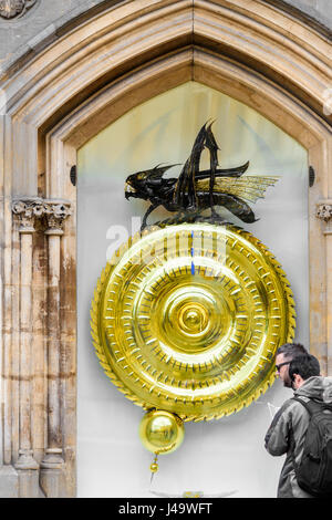 Twelve o'clock midday on the large clock and chronophage (time-eater) designed by John Taylor and installed outside Corpus Christi college at the univ Stock Photo