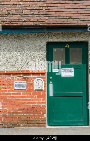 Baby changing room and coin operated public toilet at Drummer street, Cambridge, England. Stock Photo