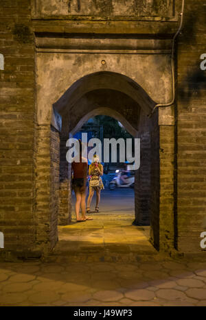 HANOI, VIETNAM - CIRCA SEPTEMBER 2014:  Young Vietnamese women at the Hoan Kiem Lake at night in Hanoi, Vietnam. Stock Photo