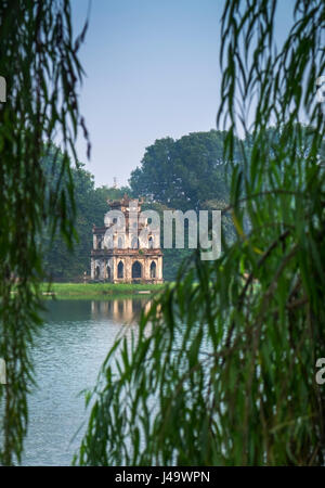 HANOI, VIETNAM - CIRCA SEPTEMBER 2014: View of the Turtle Tower, a famous landmark over the Hoan Kiem Lake, in Hanoi. Stock Photo