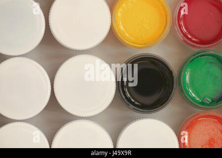 Colorful Gouache set of artistic cans Macro shot top view Stock Photo