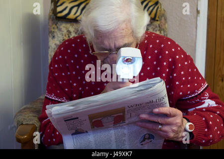 Elderly woman suffering from macular degeneration Stock Photo