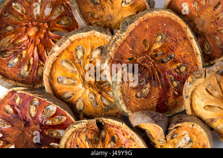 Dried bael fruit on white background Stock Photo