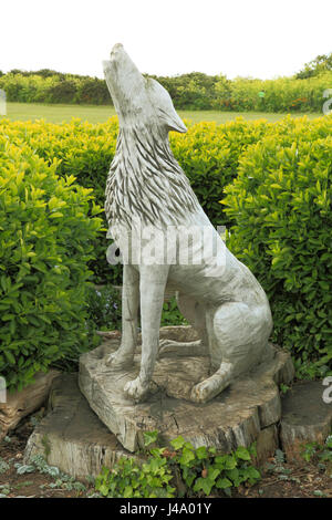 Old Hunstanton, Monument to the legendary Wolf, who guarded St. Edmund's severed head. Carved oak, wood figure, Norfolk  England UK Stock Photo