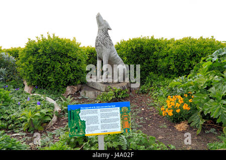 Old Hunstanton, Monument to the legendary Wolf who guarded St. Edmund's severed head. Carved oak wood figure 5 Stock Photo