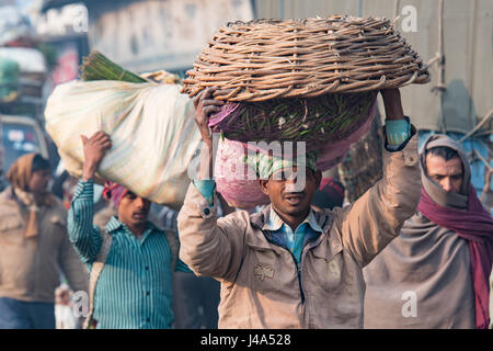 Transporting goods through the busy streets of New Delhi, India. Stock Photo