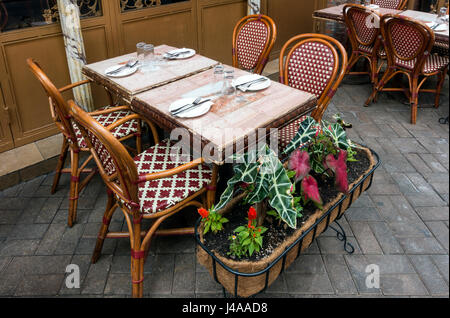 Table for four outside an Italian restaurant on Mulberry Street in Little Italy awaits customers Stock Photo