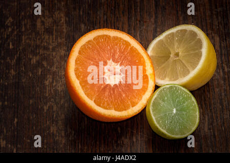 orange, lemon and lime half cut closeup copy space Stock Photo