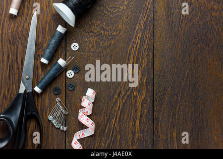 Top view tailor items on wooden background with copy space. Stock Photo