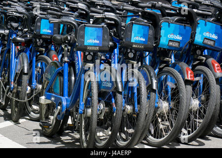 Dozens of Citi Bike bicycles at a storage station on Lafyette Street in Soho, downtown Manhattan, New York City. Stock Photo