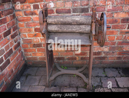 An old fashioned mangle at the rear of a house in the Pit Village at Beamish Museum,England,UK Stock Photo