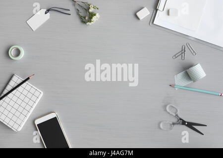 Design Space with Stationery on Gray Background Stock Photo