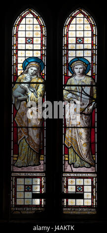 Saint Agnes and Saint Cecilia stained glass, St Mary and All Saints Church, Holcot, Northamptonshire, England, UK Stock Photo