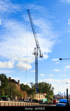 A mechanical crane beginning onstruction work on the site of the recently demolished Archway Heights building, Archway Road, London, UK Stock Photo