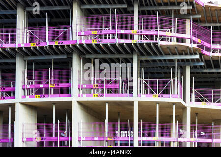 Pink safety fencing on the construction site of apartment blocks in the redevelopment of King's Cross, London, UK, 2015 Stock Photo