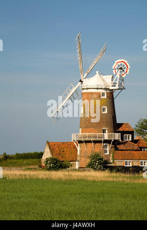 The windmill at Cley next the sea in Norfolk from across the marshes Stock Photo