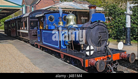 Vintage steam train leaving the station Stock Photo