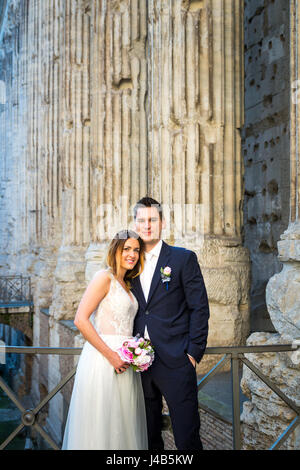 bride and groom posing on the streets Stock Photo - Alamy
