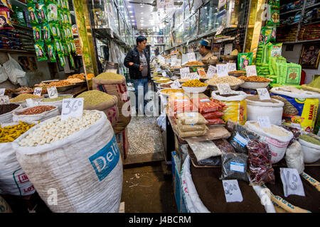 Various nuts, dried fruits, and spices on display at the market on Khari Baoli Road in New Delhi, India, Asia's largest wholesale spice market. Stock Photo