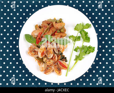 Thai recipe , Stir fried clams and eggplant with roasted chile paste call Hoi Lai  Pad Prik Phao. Stock Photo