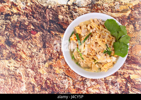 Chinese herbs for health food,Fried egg and  ginger with minced pork in soup . Stock Photo