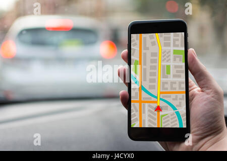 GPS Navigation on Mobile Phone Device and Transportation Concept. Male Hand Using Navigation System Map Tracking on Smartphone with Copy Space. Stock Photo