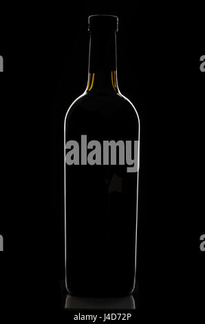 Stylish elegant black corked wine bottle reflected and outlined by light on black background. Logos removed. Stock Photo