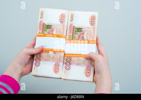 closeup human's hands holding russian rubles isolated on white background, family planing, insurance and saving money Stock Photo