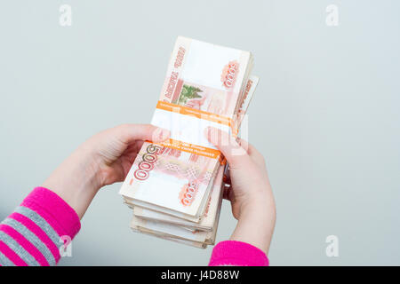 closeup human's hands holding russian rubles isolated on white background, family planing, insurance and saving money Stock Photo