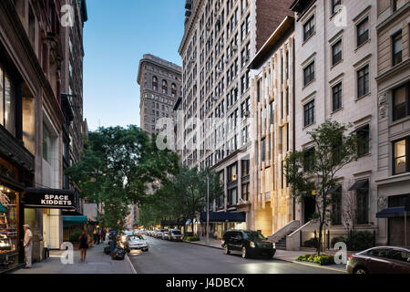 Contextual street view looking West on East 22nd Street at dusk. Gatehouse to One Madison, New York, United States. Architect: BKSK Architects, 2014. Stock Photo