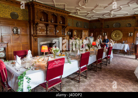 Formal dining room with set table ready for a meal at Lanhydrock, Bodmin, Cornwall. (70) Stock Photo