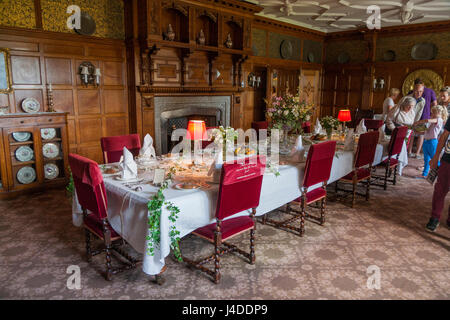 Formal dining room with set table ready for a meal at Lanhydrock, Bodmin, Cornwall. (70) Stock Photo