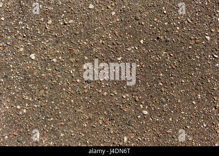 Close up detailed view of coarse asphalt road coating background or texture Stock Photo
