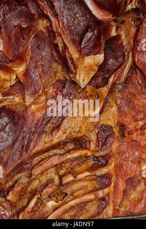 Texture of homemade smoked bacon, which serves as the background, which serves as the background. Selective focus and small depth of field Stock Photo