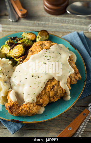 Homemade Country Fried Steak with Gravy and Potatoes Stock Photo